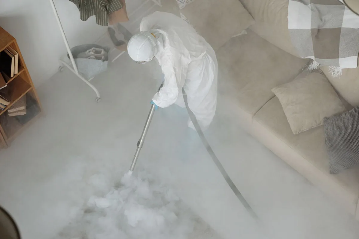 Biohazard cleanup technician in protective equipment, Corvallis, MT